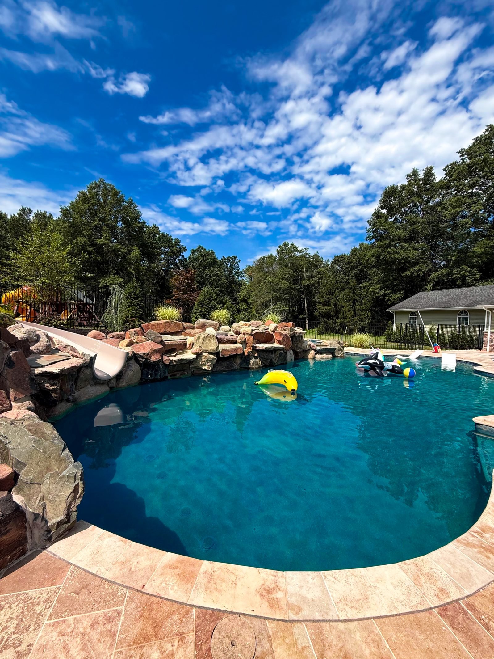 Custom rock waterfall pool serviced weekly