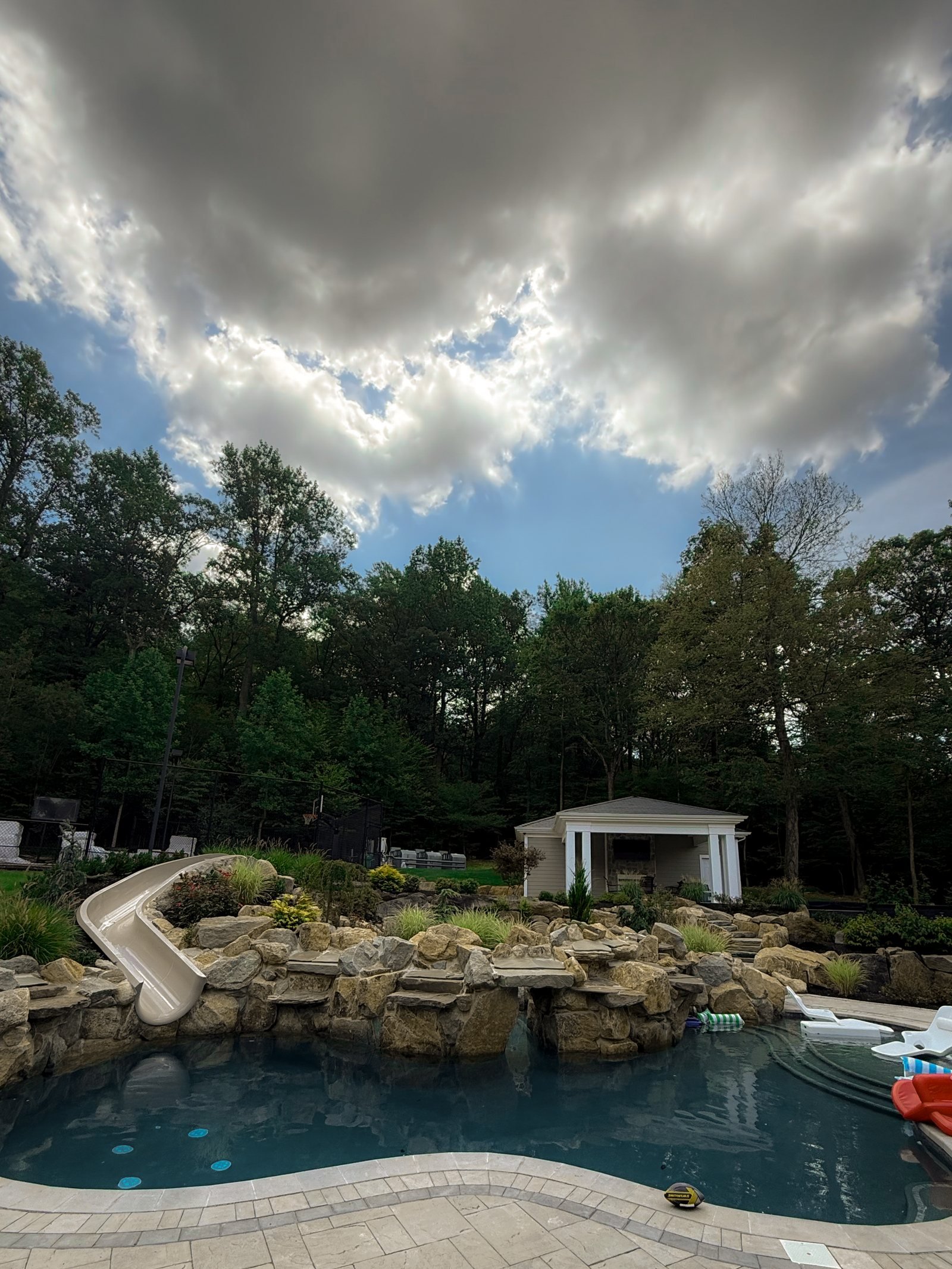 Natural stone waterfall and slide pool in North Jersey